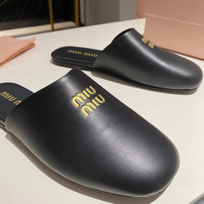 MULES SLIPPERS RETRO BLACK COWHIDE